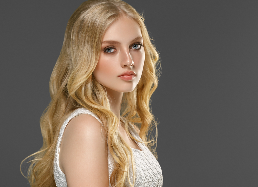 Curly long velvet blonde hair, glowing in natural light